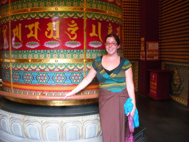 wearing a skirt/sack to (again) cover up my inappropriate clothing by the giant prayer wheel