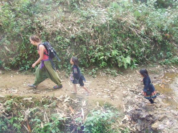 Jem being followed by the local hill tribe kids