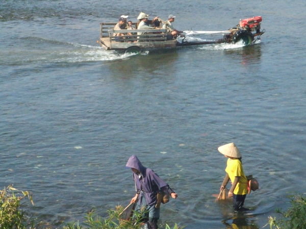 Tractor crossing the Mekong River - Laos