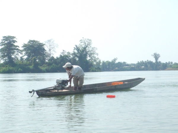 Local Laos man on his boat
