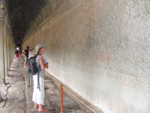 Jem browsing the carvings at Angkor Wat