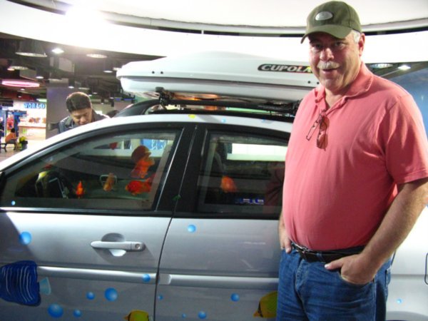 Dad beside a car full of fish