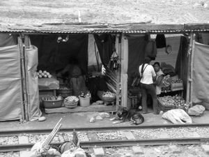 Venders selling things beside the rail tracks