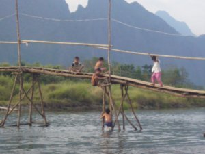 Local kids swimming off bridges