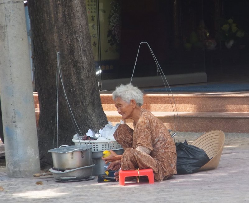 Elderly Lady Selling Phu on