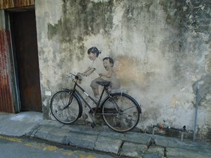 Two boys on a bike wall painting
