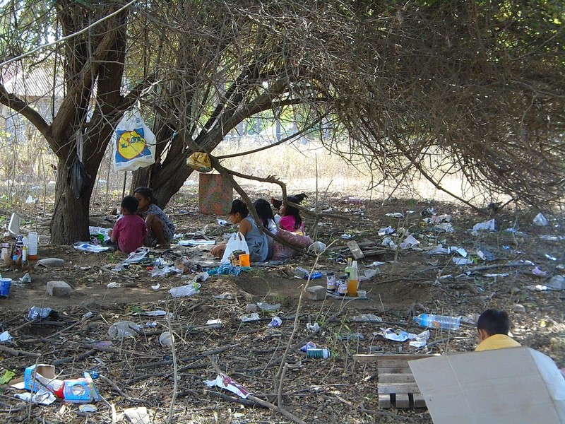 local kids playing shop with the rubbish