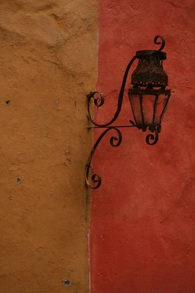 Lamp on colourful wall