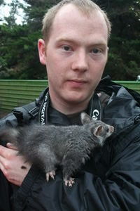 Tom being poo'd on by a possum and not looking amused!