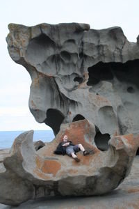 Tom sleeping at Remarkable Rocks, Kanagaroo Island