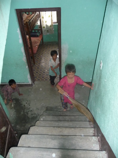 3 girls cleaning the orphanage