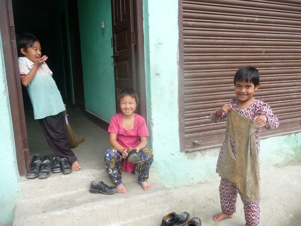 3 girls cleaning at the orphanage