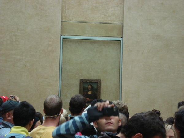 La Joconde (Mona Lisa) and the millions of people... look how small it is