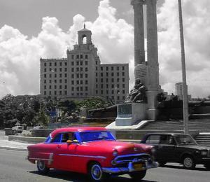 Old red car and Hotel Nacional