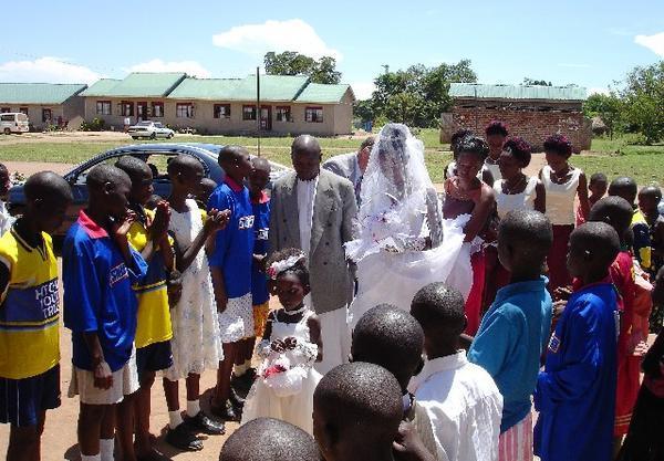 Children lined up for bride and groom