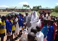 Children lined up for bride and groom