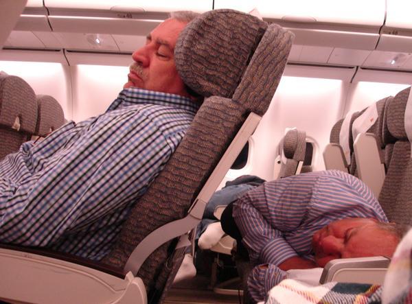 Men sleeping on flight to Buenos Aires!