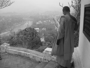 Monk on top of Phou Si Hill