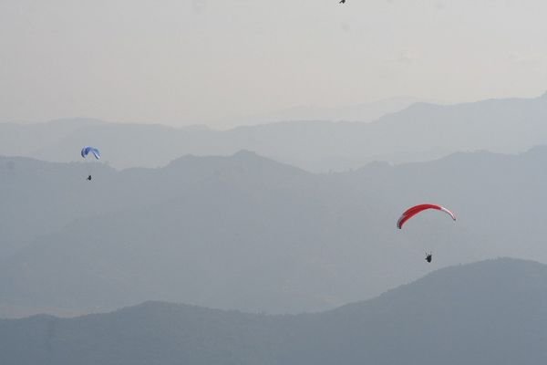 Paragliders above the Annapurna Range
