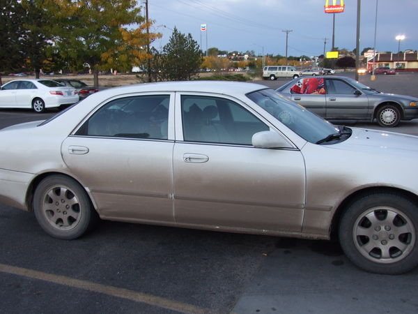 Onaxthiel's white car after 110 miles of dirt roads 