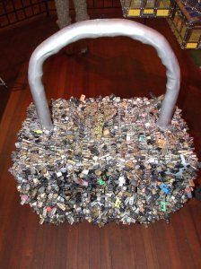 A 3.5 foot tall lock made entirely of luggage locks.