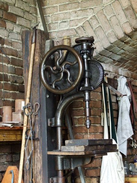 This is a flywheel drill press that the blacksmith used.