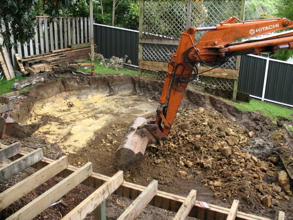 The digger gets the hole ready for the new pool