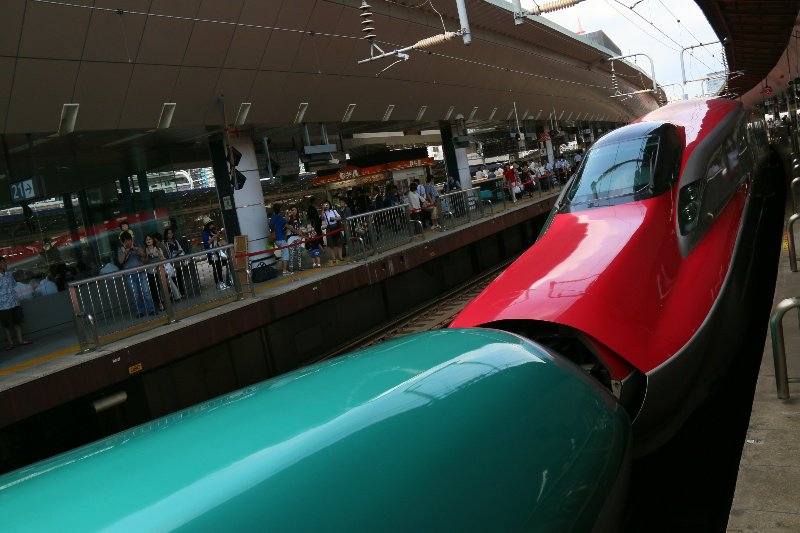 Two bullet trains attached