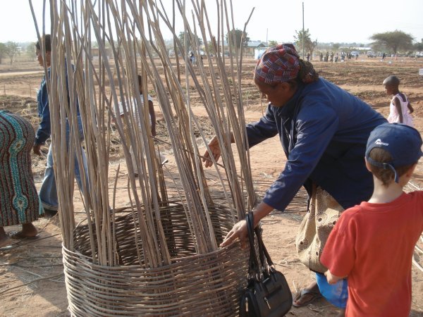 This lady at Nane Nane  was making wicker baskets to store food in.