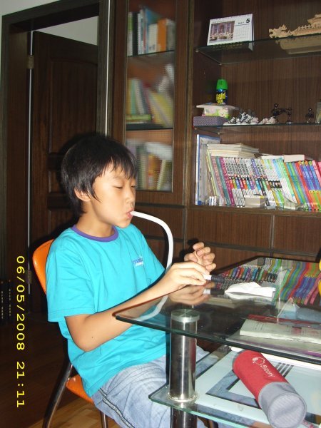 young suh playing the melodica