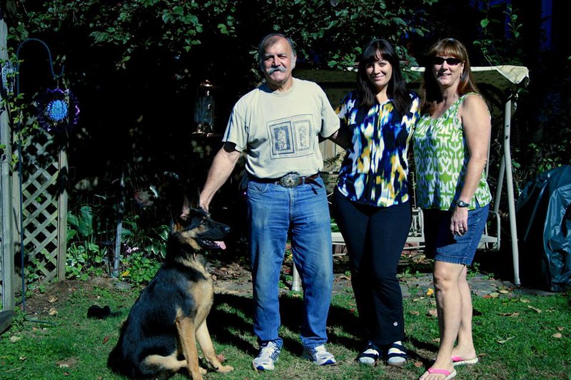 My parents, Taz and me in the backyard