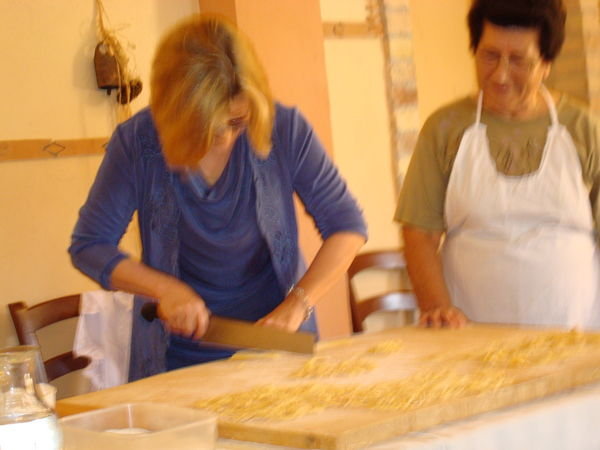Julie trying her hand at Pasta making with Grandma Lidia!