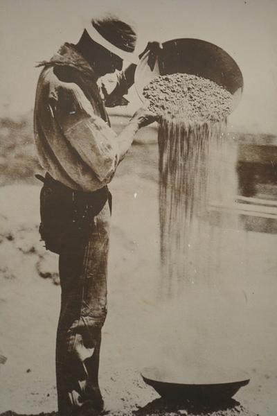 Gold miner panning for his precious metal.
