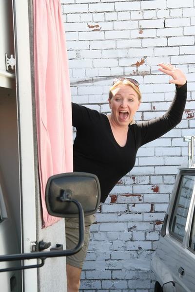 Shaz enthuses wildly while hanging out of Beryl's back door