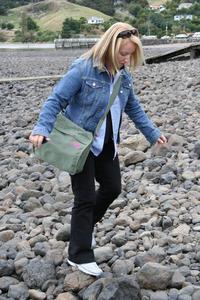 Shaz nearly breaking her good leg on the wobbly beach stones at Akaroa