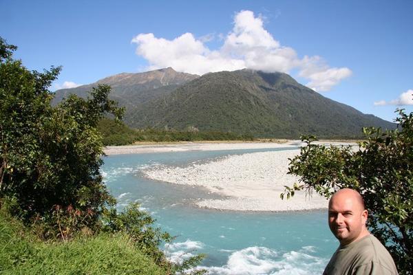 Alan enjoys the view of an amazing milky turquoise river rapid.