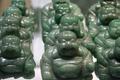 Jade Buddhas for sale in the factory shop.