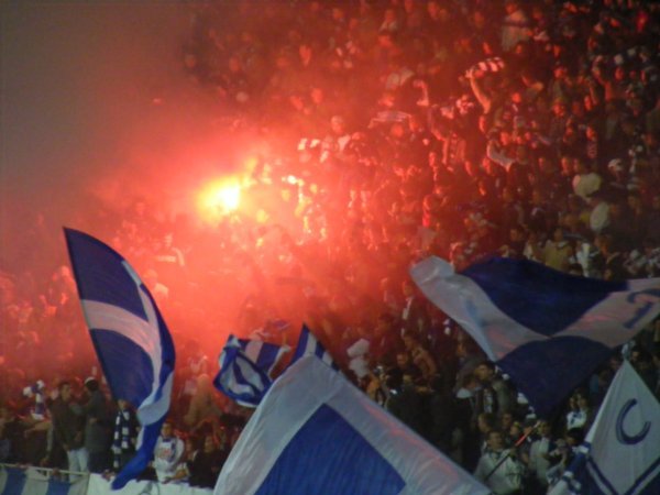 Dynamo Kyiv fans celebrate a goal against Arsenal