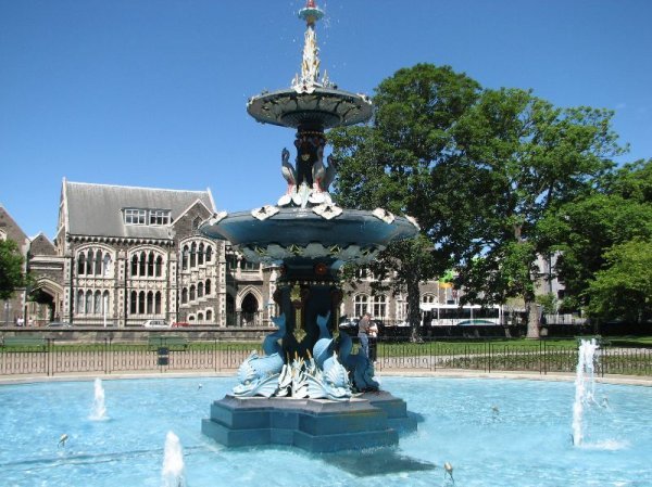 fountain with university building in backdrop