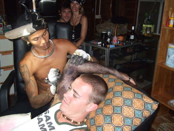 Ty being tattooed