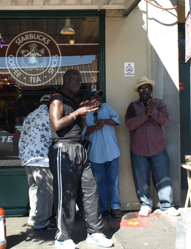 Gospel singers outside the first ever Starbucks
