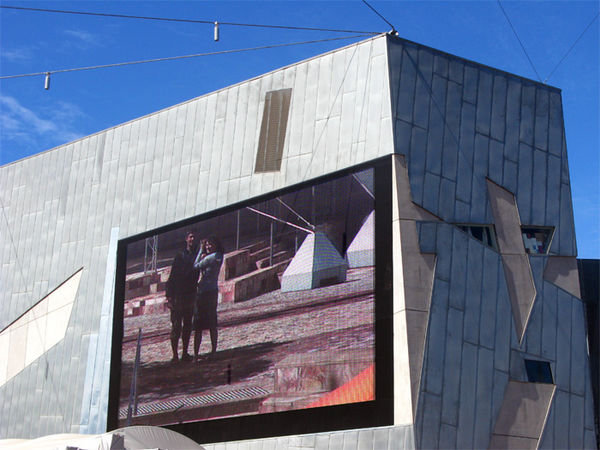 Us on the giant screen in Federation Square