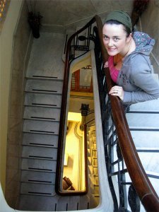 Aoife in the stariwell of the fanciest hostel to date