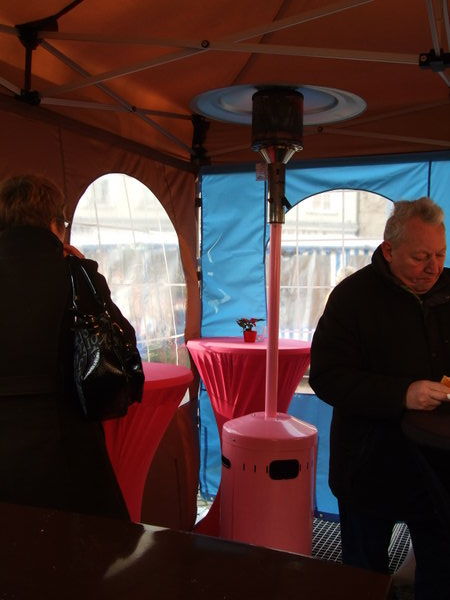a pink gas heater at a hot dog stand. Beautiful