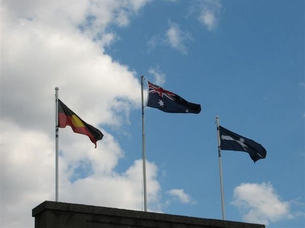 All 3 flags flying on top