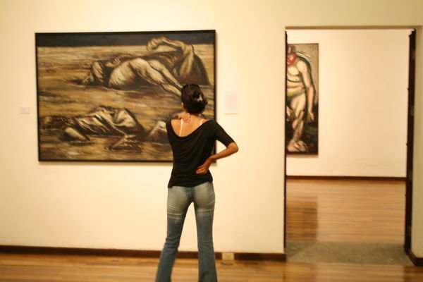 Picture of Iliana looking at art