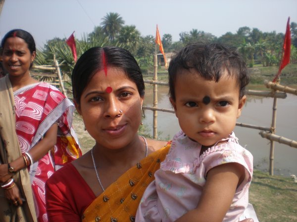 mom and baby in village
