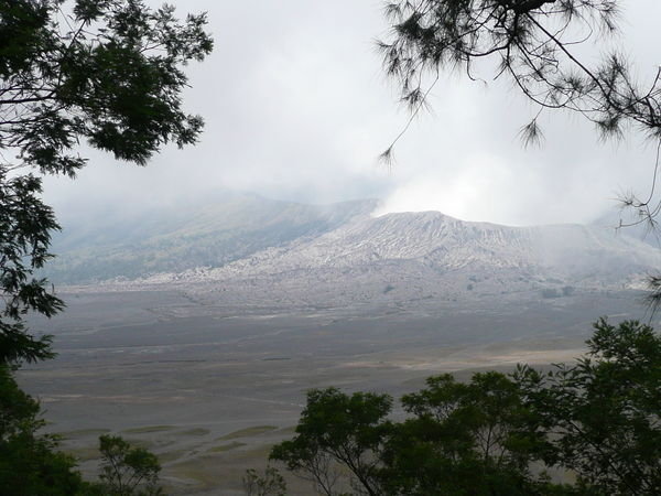 View of Bromo from the main crater rim. Sea of Sand below