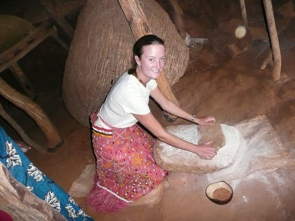 Me having a go at grinding the maize