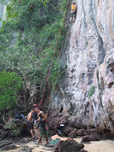 Railay is famous for rock climbing, so there are people climbing everywhere